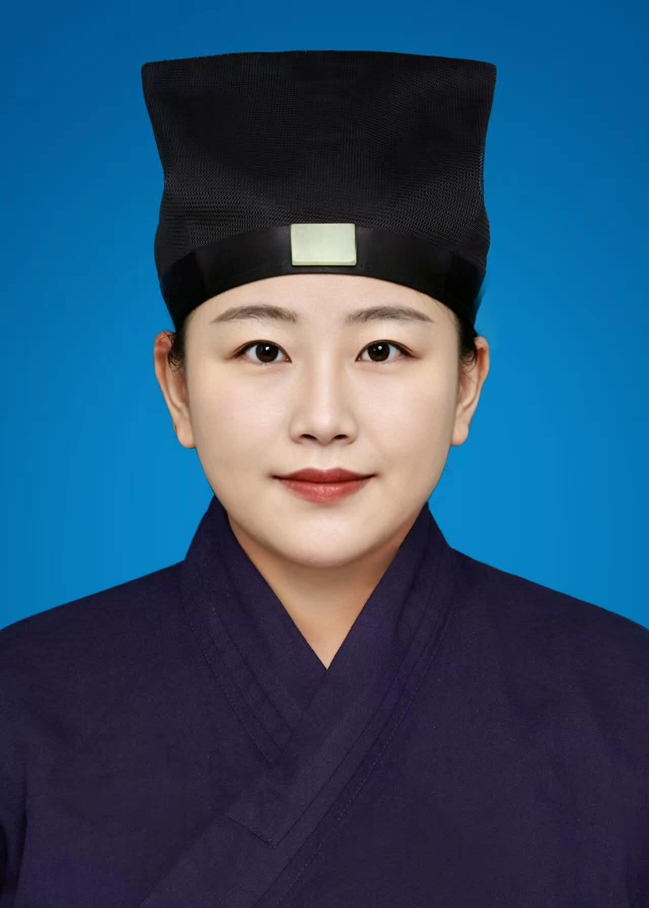 Formal portrait of Skylar Zhuang in Taoist attire